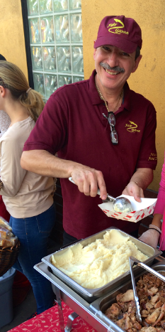 Jean-Paul Peluffo passing out food (Margaux Farrell/Neon Tommy).