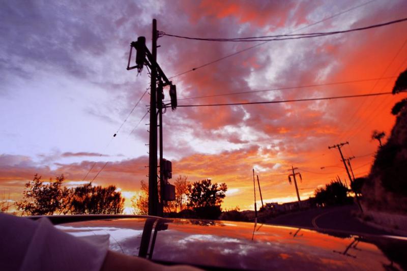 Rebecca Orlandini/Parked Car Orange Sky/ Rebecca Orlandini Photography