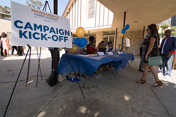 Volunteers sign in guests at the Harris-Dawson Campaign Kickoff. (Matthew Tinoco/Neon Tommy) Volunteers sign in guests at the Harris-Dawson Campaign Kickoff. (Matthew Tinoco/Neon Tommy)