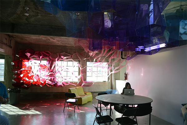 A student works beneath last year's Freshman installation. (Matthew Tinoco/Neon Tommy)