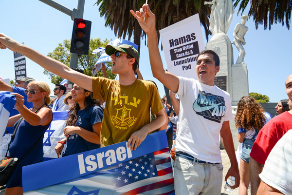 At the time, these Israeli demonstrators were shouting "Go back to Jordan, Arab scum." (Matthew Tinoco/Neon Tommy) At the time, these Israeli demonstrators were shouting "Go back to Jordan, Arab scum." (Matthew Tinoco/Neon Tommy)