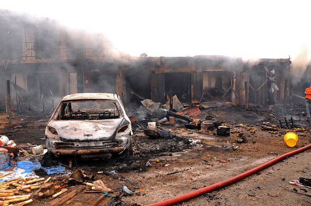 The remains of a building smolder after a Boko Haram car bombing previous to the attacks on Baga. (Diariocritico de Venezuela/Creative Commons Flickr) 