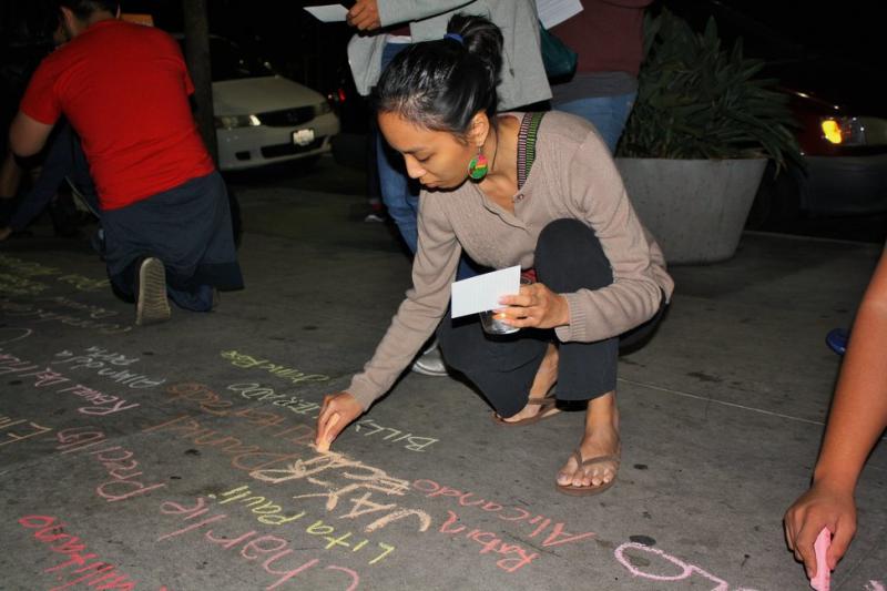 Names of Haiyan victims cover the Wilshire sidewalk. (Heidi Carreon/Neon Tommy)