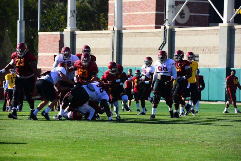 Defense pushes to keep the offensive line down. (Neon Tommy/Charlie Magovern) Defense pushes to keep the offensive line down. (Neon Tommy/Charlie Magovern)