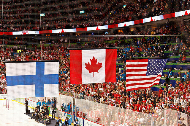 The flags of Canada, USA, and Finland are raised four years ago in Vancouver (s.yume / Flickr)