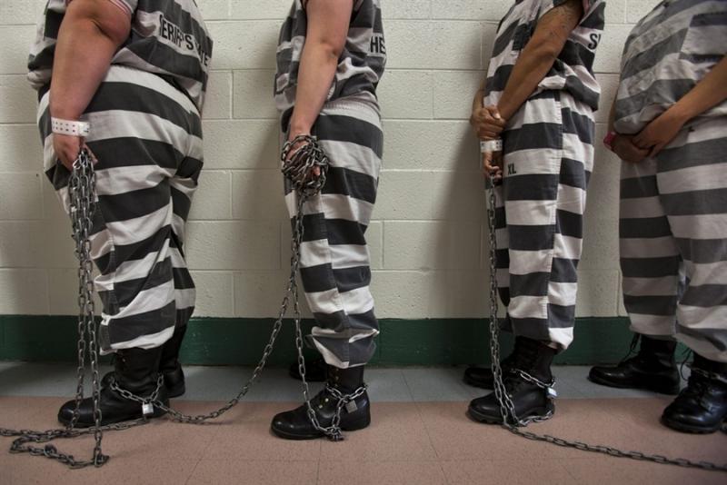 An all-female chain gang at Estrella Jail in Maricopa County, AZ, prepares to leave for the day's worksite (Jim Lo Scalzo / European Pressphoto Agency)