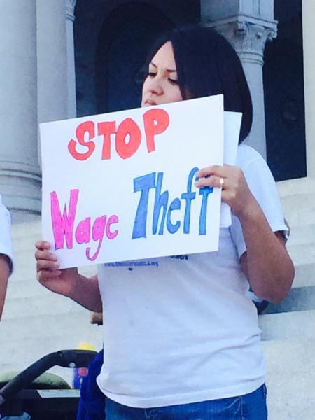 Minimum wage workers protested outside of City Hall on Tuesday. (Danica Ceballos/Neon Tommy)