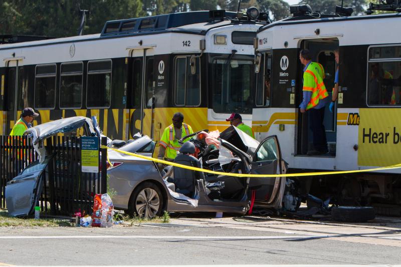 The train was derailed after the car got trapped between a pole and the train. (Ben Dunn/Neon Tommy)