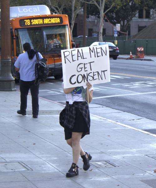 Molly McIsaac, an L.A. resident, passes out information on SB967 in front of City Hall. (Rebecca Gibian/Neon Tommy)