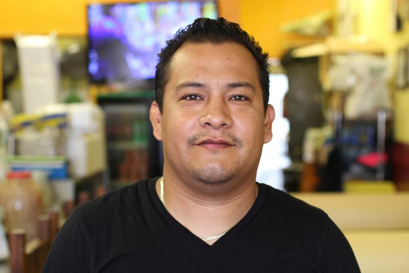 Eduardo Gomez, a waiter at Yeya’s Restaurant, worries that a higher minimum wage would make the business lose customers (Taylor Haney/Neon Tommy)