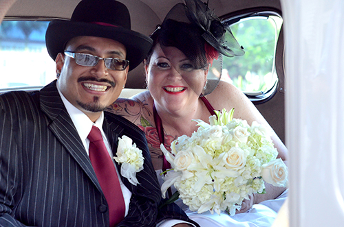 Eduardo and Michelle Reyes leave their ceremony in style. (Photo by Hillary Jackson/Neon Tommy.)