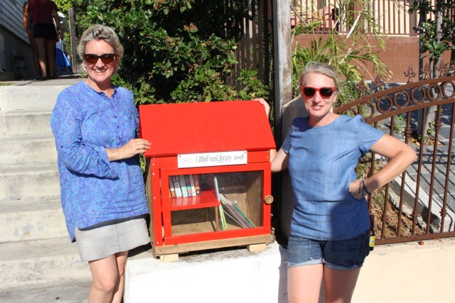 Jane Summers and Sophie Dick pose with their Little Free Library in Los Feliz.  (Courtesy of Sophie Dick)