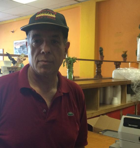 Carlos Rodriquez, a restaurant owner in Van Nuys, says a performance-based wage system would be more fair. (Raakhee Natha) Carlos Rodriquez, a restaurant owner in Van Nuys, says a performance-based wage system would be more fair. (Raakhee Natha)