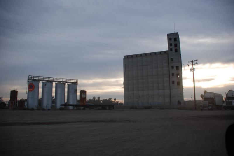 Leaving Corcoran, factories and silos sit quietly beside the major artery on the way out. (Carrie Poppy/Neon Tommy)
