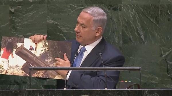 The Israeli Prime Minister shows the U.N. a photo of a rocket launcher set near children. (@TimesofIsrael/Twitter)