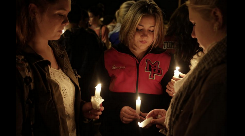 Students gather in memory of classmates lost after a school shooting. (Buzzfeed/Twitter)
