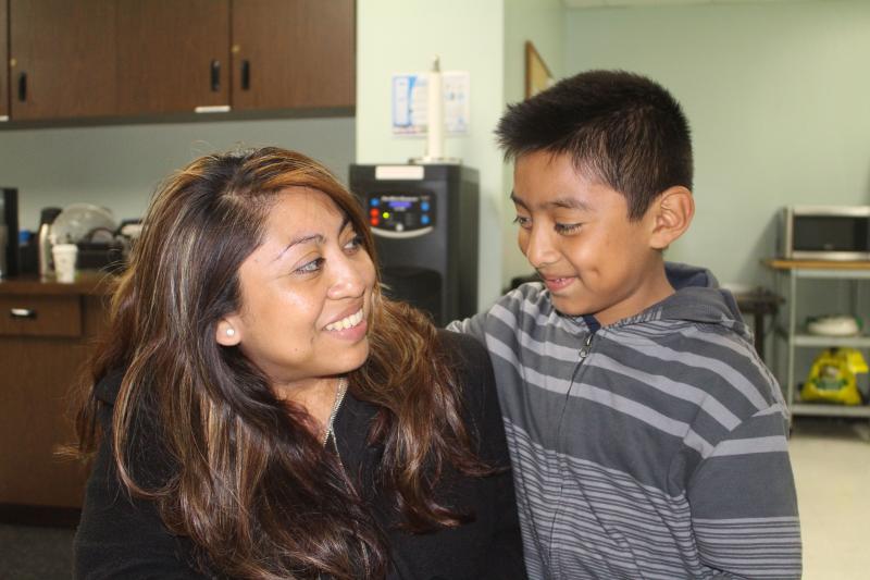 Claudia Chi Ku and her 7-year-old son Johnny live in a one-bedroom apartment in Pico-Union, along with his three siblings. (Matt Lemas/Neon Tommy) 