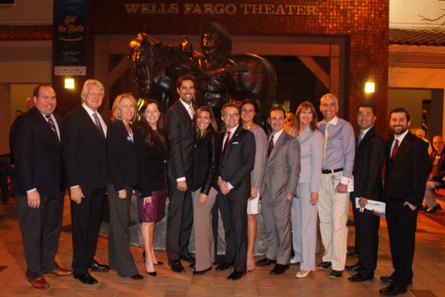 Eleven candidates pose for a photo op during a candidate forum hosted by the Los Feliz Improvement Association on Feb. 2, moderated by ABC 7's Elex Michaelson.  (Matt Lemas/Neon Tommy)