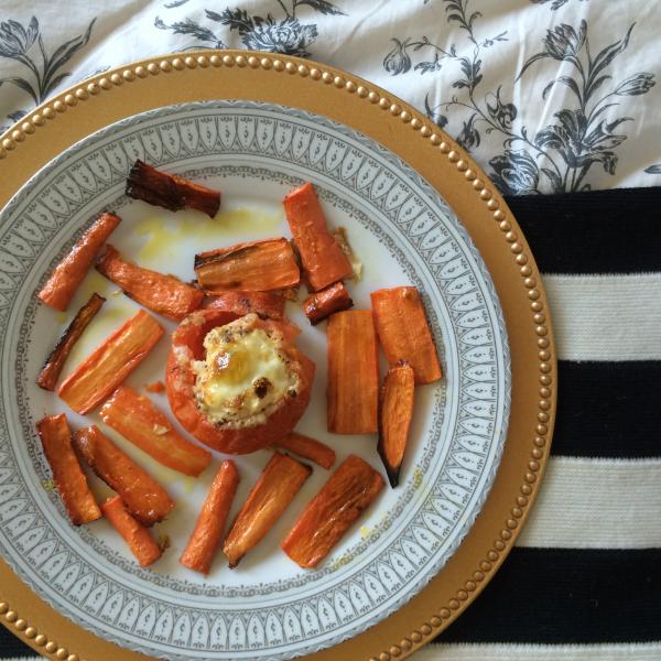 A Lacto-ovotarian breakfast: roasted carrots surround an egg baked inside a hollowed and seasoned tomato. (Marisa Zocco / Neon Tommy)