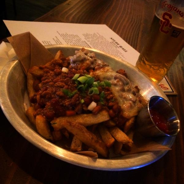 Manny's Chili Cheese Fries made with 28-spiced pork, hand-cut Kennebec fries and topped with smoked mozzarella pleases the palate. (By Marisa Zocco)