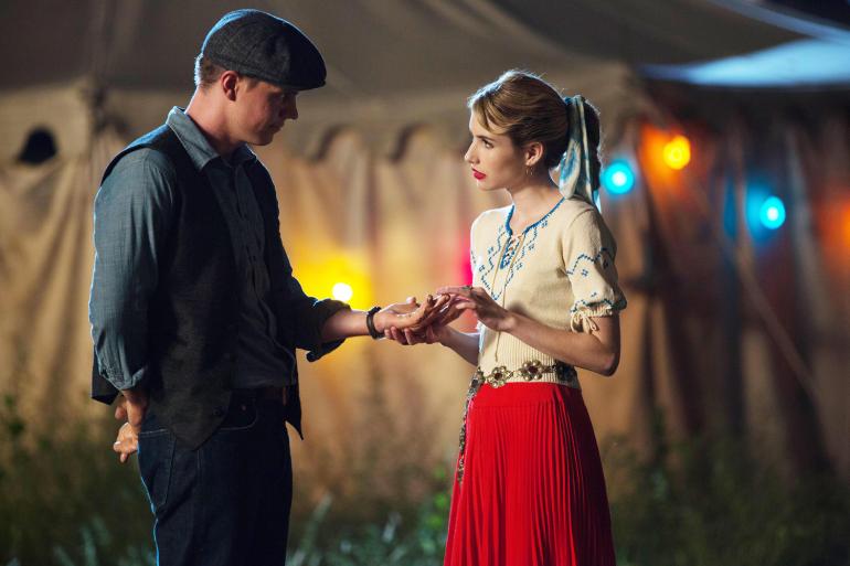 Esmerelda (Emma Roberts) gives Jimmy (Evan Peters) a free palm reading (FX)