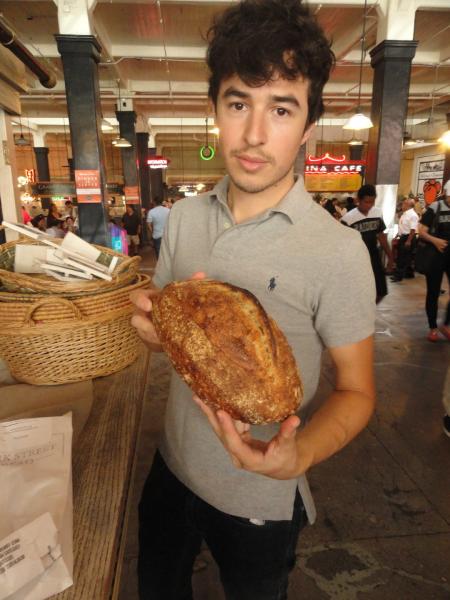 Clark Street Bread's Zack Hall shows off his goods. (Sara Tiano/Neon Tommy)