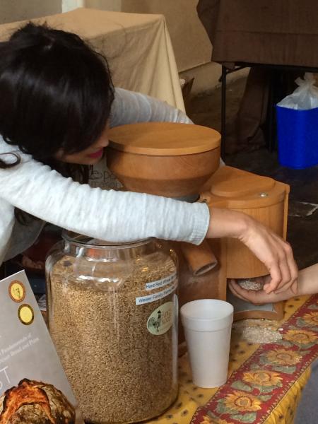 An at-home flour milling demo at the King's Roost booth. (Sara Tiano/Neon Tommy)