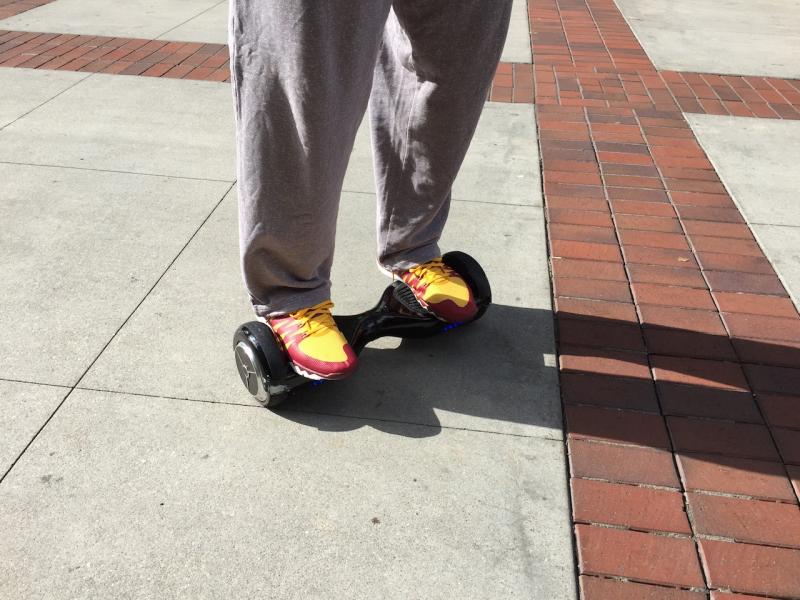 Darion Clark, USC men's basketball player, rides a hoverboard (Joy Hahn / Neon Tommy)