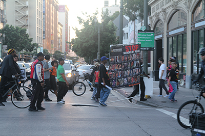 Demonstrators protesting police killings carry a sign that reads "stop murder by police" in downtown Los Angeles on Oct. 22, 2015. (Whitney Ashton/Annenberg Media) 