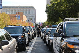 Rows of police cars and other law enforcement vehicles line the streets in front of the cathedral in Downtown Los Angeles. (Whitney Ashton/Annenberg Media)