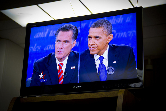 Obama and Romney on screen during a debate watching party Monday night in Arcadia, California.(Rosa Trieu/Neon Tommy)