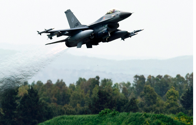 A Dutch F-16 fighter involved in the Libya airstrikes takes off from the military airfield Giovanni Farina Decimomannu, Sardinia, Italy.  (NAT0)