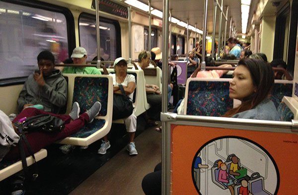 Navarro rides the Metro to 7th Street/Metro Center. (Jen Mac Ramos / Annenberg Media)