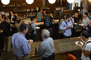 Civic hackers enjoying pizza and beer between brainstorming sessions. (Chole Marie Rivera/Neon Tommy)