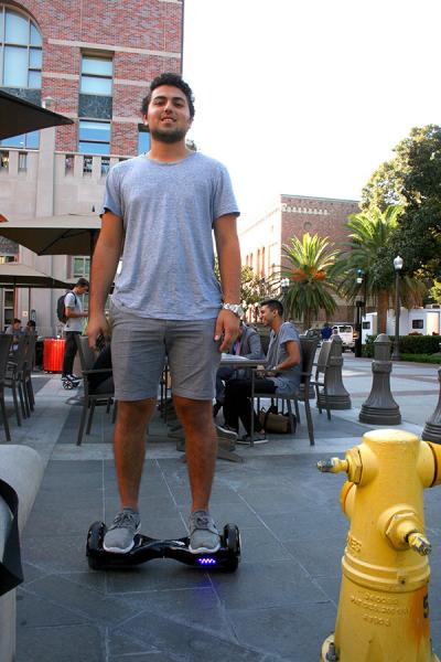 USC student Ethan Mezrahi rides his board between classes. (Photo by Madeline White, Annenberg Media)