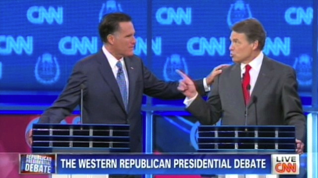 Mitt Romney and Rick Perry have a touching moment at the Tuesday debate in Las Vegas, Courtesy of CNN