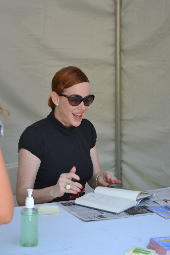 Ringwald signing books after the talk (Kristin Yinger/Neon Tommy).