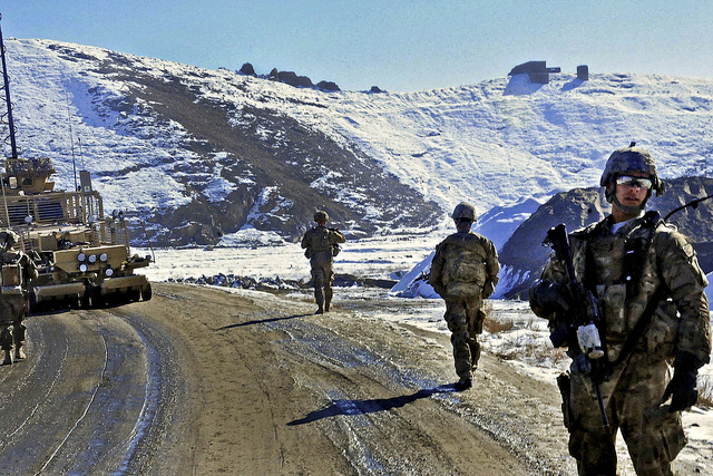 U.S. Army 1st Lt. George Rousson (right), calls his Soldiers back to the vehicles after a known area of interest is investigated and cleared by the combat engineers of RCP-30 in Eastern Afghanistan Jan. 19. (US Army, Creative Commons)