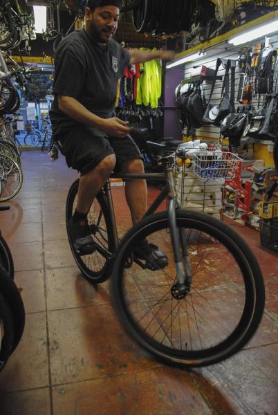 The Bicycle Doctor wanted to show off his bar spins while still waiting for David, his other employee, to come back and watch the shop. This is 1 of his 3 bikes that he owns. (Taken by Nathan Carzon) The Bicycle Doctor wanted to show off his bar spins while still waiting for David, his other employee, to come back and watch the shop. This is 1 of his 3 bikes that he owns. (Taken by Nathan Carzon)