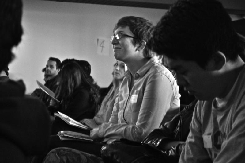 Isabel listens attentively to a speech, in hopes of developing new skills to help the interns and volunteers succeed in their campaigns.