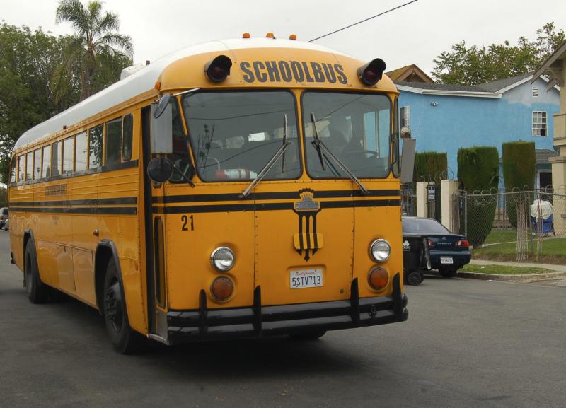 A school bus awaits the students outside Lindsay’s College-Ready Academy High School.