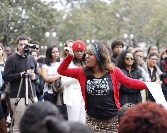 The crowd listens to sophomore Isabel Bravo deliver a fiery take on race issues at USC. The crowd listens to sophomore Isabel Bravo deliver a fiery take on race issues at USC.