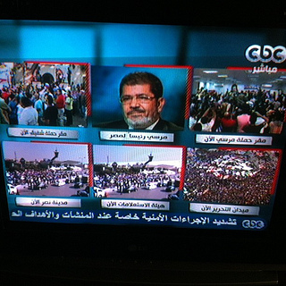 Mursi's face on television when he was elected.  (Flickr Creative Commons)