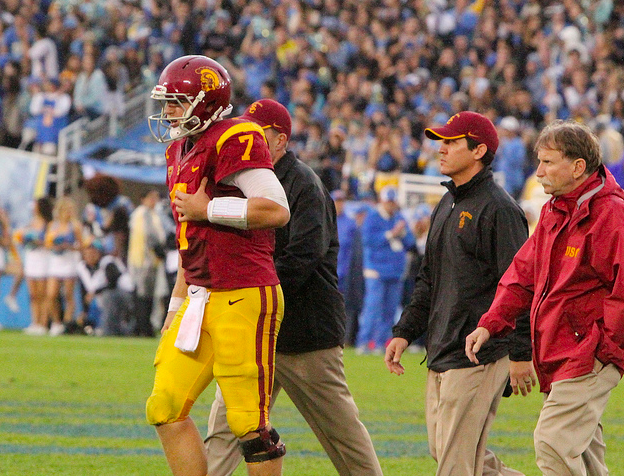 Matt Barkley walks off the field after being injured against UCLA. (James Santelli/NT)