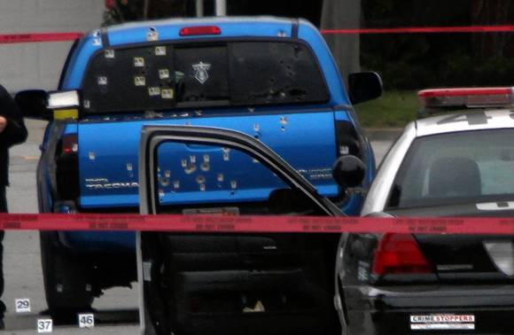 The two women were sitting in this truck when officers opened fire. (Los Angeles Times)