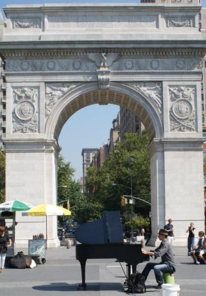 Colin Huggins and his piano in Washington Square (Photo by Ben Treuhaft)