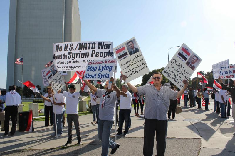 Assad supporters told the media to stop lying about the regime's handling of the violence. (Shako Liu/Neon Tommy)