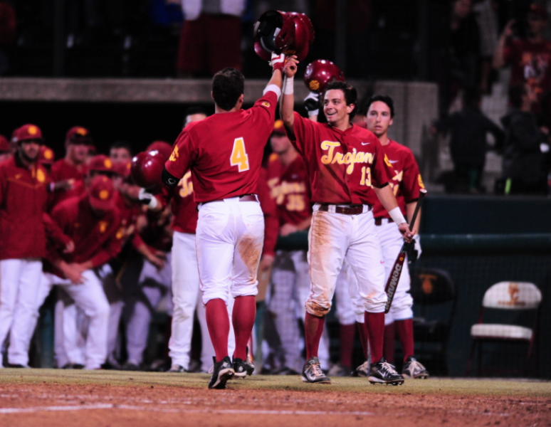 Teammates congratulate Bobby Stahel (4) after his home run in the second inning. (Charlie Magovern/Neon Tommy)