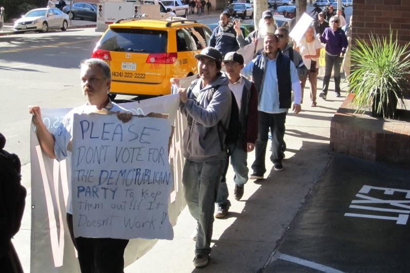 Protesters march the streets of downtown L.A. to rally against auction companies and banks profiting from foreclosed homes (Photo by Danny Lee).
