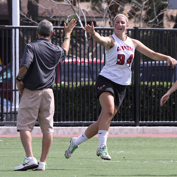 Wilkinson with her coach before their win over King's College. (Larry Newman/Chapman Athletics)